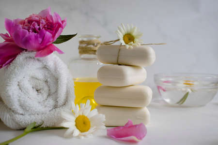 Soap cosmetic flower chamomile, peony on a light background