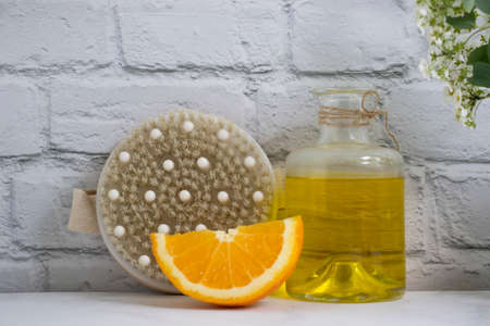 Massage brush, orange, oil, flowerの写真素材