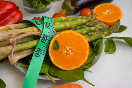 Measuring tape vegetables and fruitsの写真素材