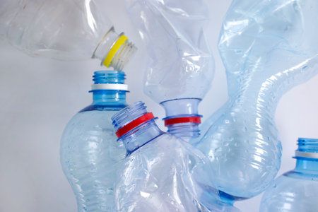 Used plastic bottle on a light backgroundの写真素材