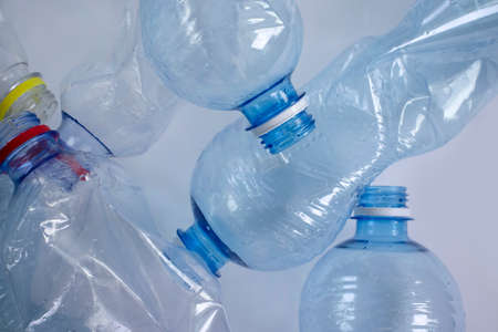 Used plastic bottle on a light backgroundの写真素材