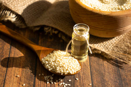 Sesame seeds spoon on old backgroundの写真素材