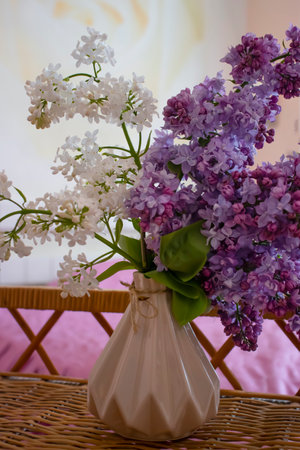 Beautiful bouquet of blooming lilacs in the roomの写真素材