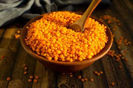 Dry red lentils on old backgroundの写真素材