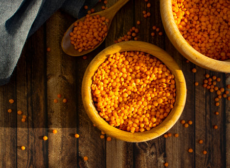 Dry red lentils on old backgroundの写真素材