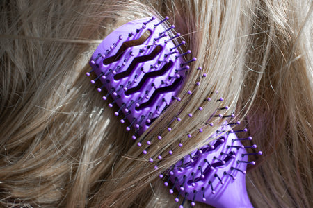 Comb and blComb and blond hair close-upond hair close-upの写真素材