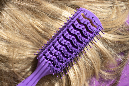 Comb and blComb and blond hair close-upond hair close-upの写真素材