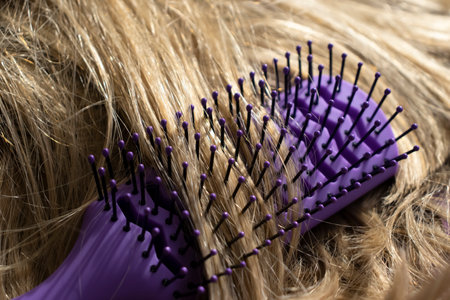 Comb and blComb and blond hair close-upond hair close-upの写真素材