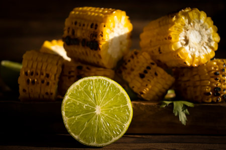 Grilled corn on wooden backgroundの写真素材