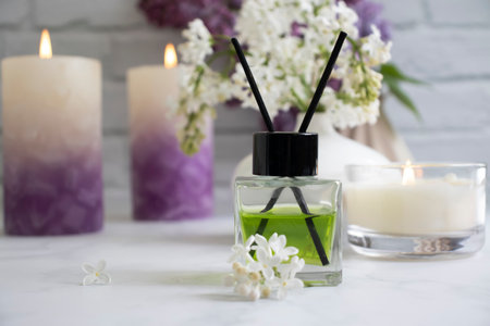 Perfume for home, flower, candle on a light background