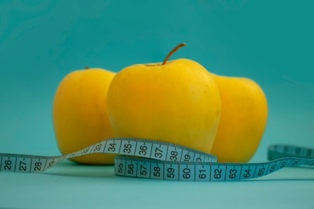 Apple measuring tape on colored background