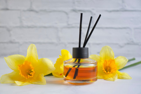 Perfume for home, flower on a light background