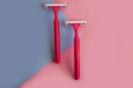 Female shaving machine on a colored backgroundの写真素材