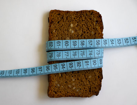 Bread piece measuring tape on light background