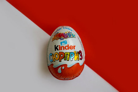 January 10, 2022 Ukraine city Kyiv Kinder Surprise chocolate egg on a colored backgroundのeditorial素材