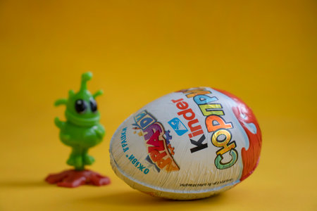 January 10, 2022 Ukraine city Kyiv Kinder Surprise chocolate egg on a colored backgroundのeditorial素材