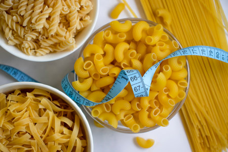 Dry pasta, spaghetti, measuring tape cooking calories