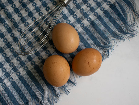 Fresh eggs in a bowl on a dark backgroundの写真素材