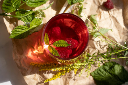 Drink with raspberries on a light background