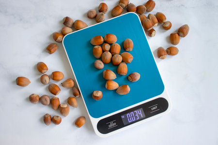 Forest nuts, kitchen scales backgroundの写真素材