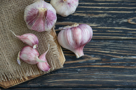 Fresh garlic on old backgroundの写真素材