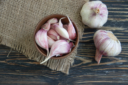 Fresh garlic on old backgroundの写真素材