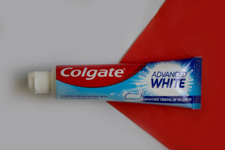 April 25, 2023 Ukraine city Kyiv Colgate toothpaste on a colored backgroundのeditorial素材