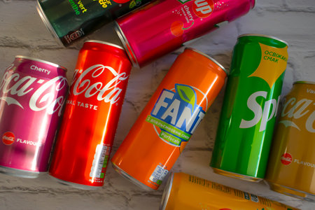 April 22, 2022 Ukraine city of Kyiv iron cans of Coca Cola, Sprite, Fanta, 7 up on a light backgroud
