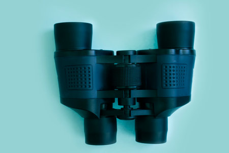 Binoculars on a colored background