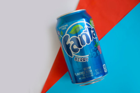 May 18, 2022 Ukraine city Kyiv jar Fanta cherry drink on a colored backgroundのeditorial素材