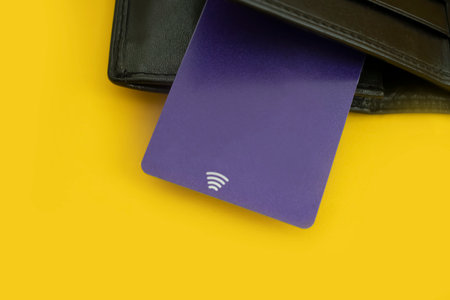 Wallet, bank card on a colored backgroundの写真素材