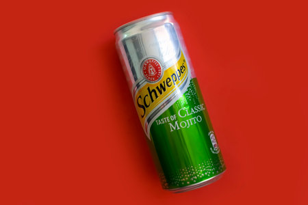 May 22, 2023 Ukraine city Kyiv drink in an iron can Schweppes classic mojito on a colored backgroundのeditorial素材