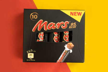 May 30, 2023 Ukraine city Kyiv chocolate bar Mars on a colored backgroundのeditorial素材