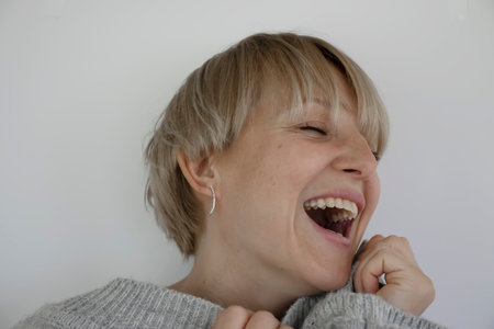 Smiling happy woman portrait on light background