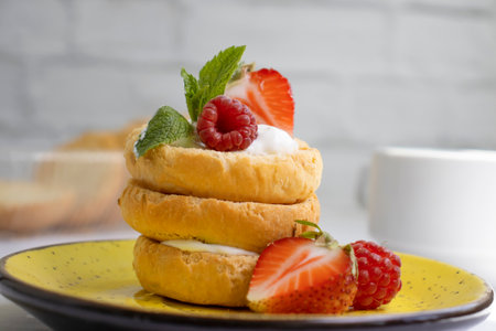 Bread with strawberries, mint on a light backgroundの写真素材