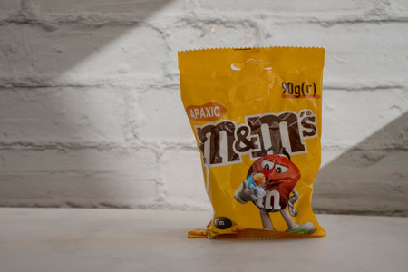 August 1, 2023 chocolate M & Ms on a colored backgroundのeditorial素材