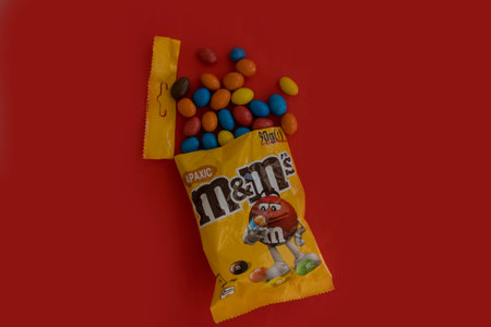 August 1, 2023 chocolate M & Ms on a colored backgroundのeditorial素材