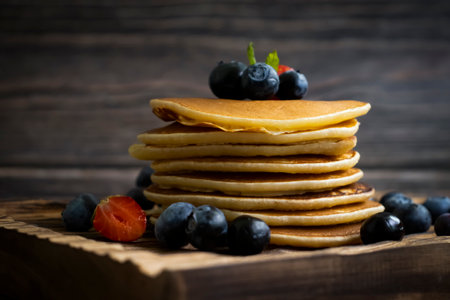 Pancakes with blueberries and strawberriesの写真素材