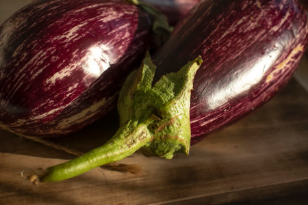 Striped eggplant on old background