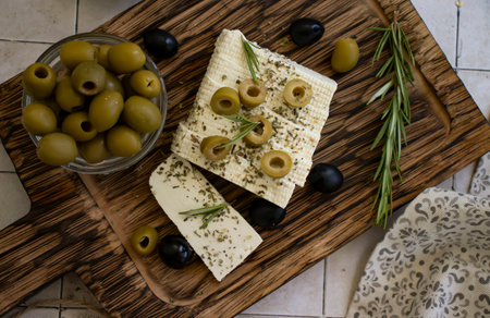 Tofu cheese with olives on old backgroundの写真素材