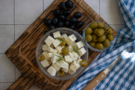 Tofu cheese with olives on old backgroundの写真素材