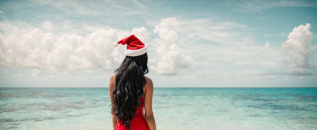 Beautiful Girl with long hair in a Santa hat against the background of the seaの素材
