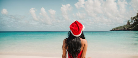 Beautiful Girl with long hair in a Santa hat against the background of the seaの素材