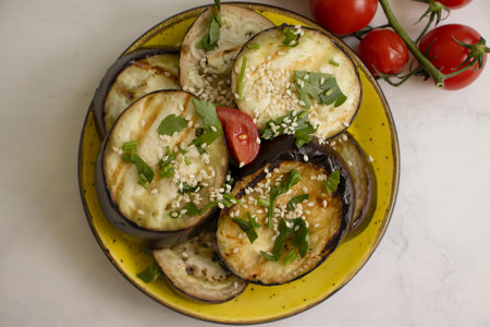 Fried grilled eggplants with tomatoesの写真素材