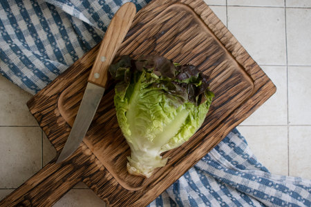 Fresh cabbage on the kitchen boardの写真素材