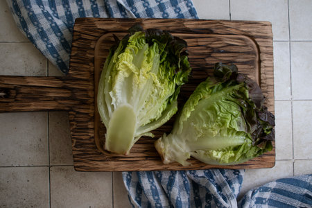 Fresh cabbage on the kitchen boardの写真素材