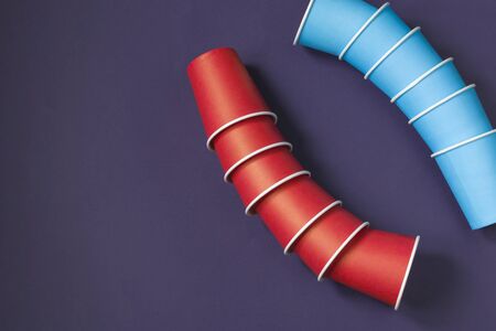 Paper cups on a dark background. Ecological tableware. Minimalistic style. Top view. Copy space.の写真素材