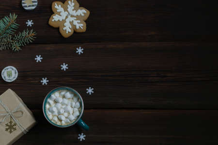 Christmas New Year card. Cup of hot drink with marshmallows, New Year's gift, gingerbread,...