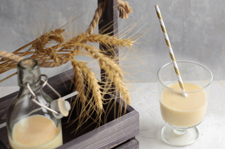 Vegetable vegan milk in mugs on a wooden background. Gluten and lactose free healthy food concept. Diet drinks for breakfast. Country style. Top viewの写真素材