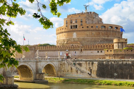 Saint Angelo Castle Rome Italy and bridge over Tiber through green leavesのeditorial素材